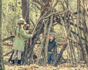 little girl in the wood near hut