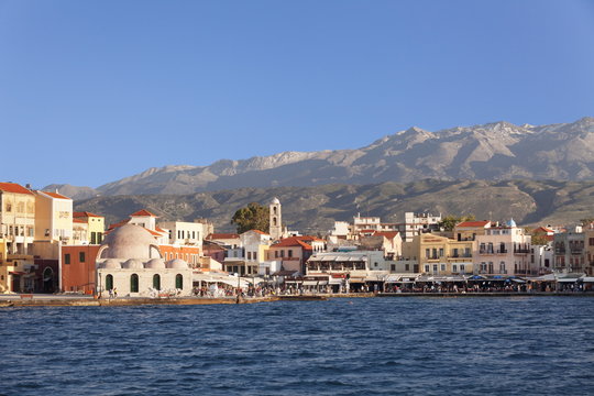 Venetian port and Turkish Mosque Hassan Pascha in front of Lefka Ori Mountains (White Mountains), Chania, Crete, Greek Islands, Greece