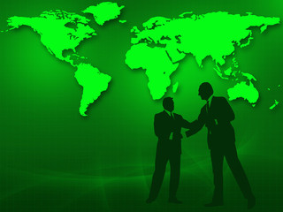 Two businessmen in a handshake in front of the world map.