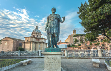 Bronze statue of roman emperor Julius Caesar on the roman forum - obrazy, fototapety, plakaty