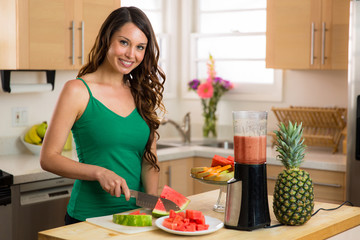 Obraz na płótnie Canvas Wife mother beautiful woman home preparing breakfast fruit smoothie healthy lifestyle nutritionist 