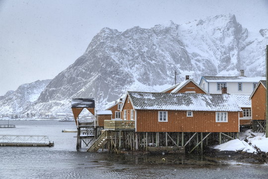 A violent and sudden snowstorm begins to fall in the Bay of Hamnoy famous for Rorbu cottages in the Lofoten Islands, Hamnoy, Lofoten Islands, Arctic