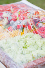 Assorted fruits, wrapped in plastic wrap set for wedding dinner