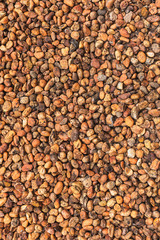 Orange tone decoration pebbles as a background.