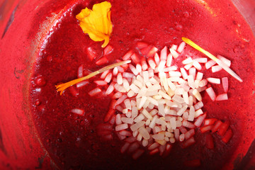 auspicious tilak with kumkum, rice and flower