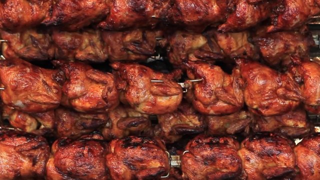 Grilled chicken rotate on skewer at the Oktoberfest in Munich