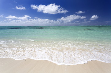 Idyllic beach scene with blue sky, aquamarine sea and soft sand, Ile Aux Cerfs, Mauritius