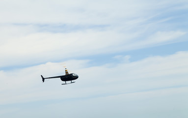 Fototapeta na wymiar The helicopter in the sky