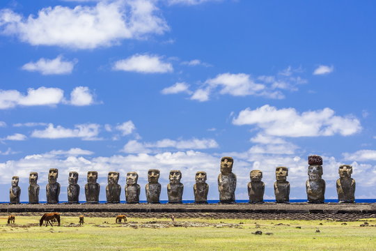 Horses grazing at the 15 moai restored ceremonial site of Ahu Tongariki on Easter Island (Isla de Pascua) (Rapa Nui), Chile