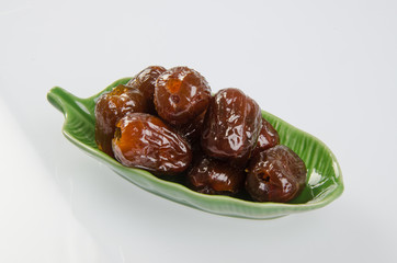 Dried preserved. Sweet syrup monkey apple or Chinese date on bac