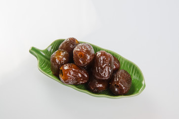 Dried preserved. Sweet syrup monkey apple or Chinese date on bac