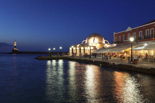 Lighthouse at Venetian port and Turkish Mosque Hassan Pascha at night, Chania, Crete, Greek Islands, Greece