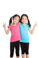 Happy Asian twins girls  smile show victory sign