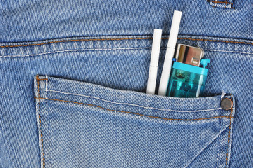 Cigarettes with lighter in a denim pocket