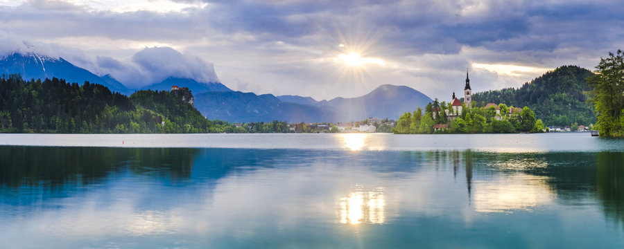 Lake Bled at sunrise with the Church on Lake Bled Island and Bled Castle, Gorenjska Region, Slovenia