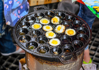 Girl Frying Quail Eggs