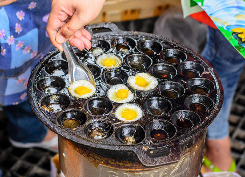 Girl Frying Quail Eggs