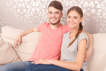 Young couple siting on sofa 