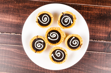 Chocolate tart on wooden board
