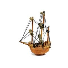 Old miniature sailboat made with a nut shell. Isolated on white.