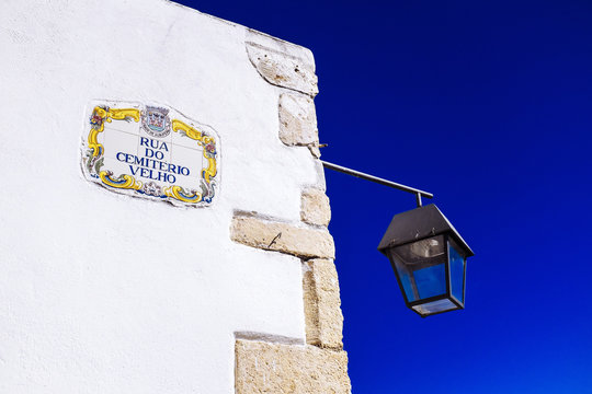 Traditional local street sign and street lamp, Old Town, Albufeira, Algarve, Portugal