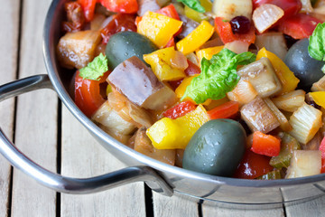  cooked vegetable salad made from chopped fried eggplant. Traditional sicilian dish.