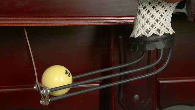 Three billiard ball falls into a pocket. Close-up.