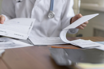 Doctor working with test results