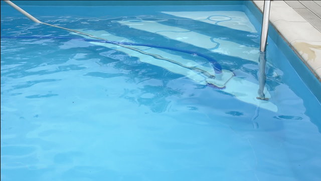 Cleaning the swimming pool cleaner water.