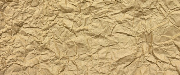 Close-up Of Rough Golden Brown Wrinkled Packaging Paper Texture