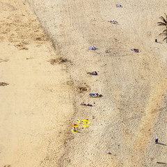beach with tourists in summer in Arrecife, Spain