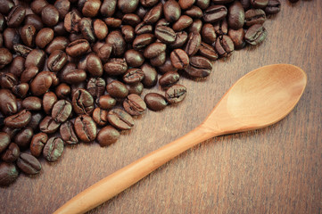 Coffee beans and wooden spoon with filter effect retro vintage s