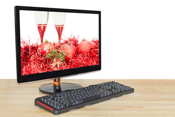 red baubles and glasses on screen desktop monitor