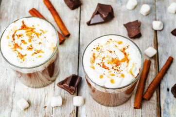 hot dark chocolate with whipped cream, cinnamon and salted caram
