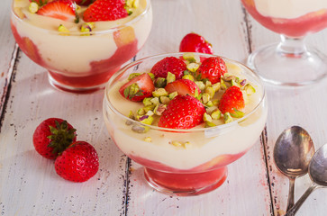 Strawberry tiramisu decorated with pieces of strawberries and pi