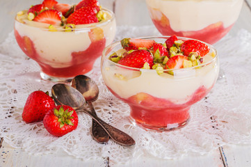 Strawberry tiramisu decorated with pieces of strawberries and pi