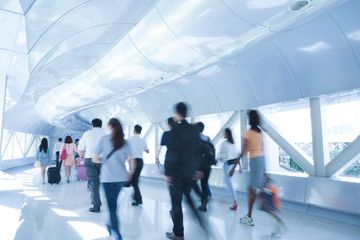 Business people walking in the office corridor.