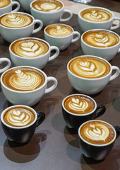 Many cup of  cappuccino coffee.
