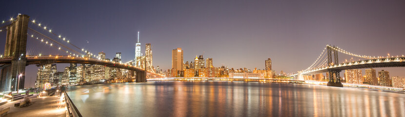 Naklejka na ściany i meble Panoramic View Manhattan Bridge, Brooklyn Bridge and Manhattan Skyline at night