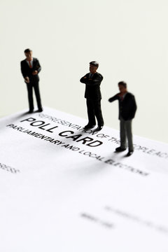 Poll card model candidate.
Miniature scale model politicians standing on a British poll card.