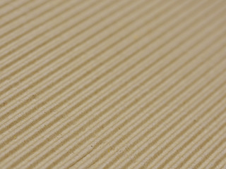 Brown corrugated cardboard background selective focus