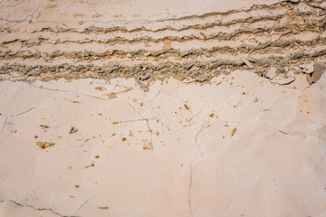 Wheel track on dried cracked soil