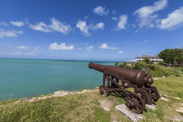 A cannon dating from the 17th century stands guard at Fort James one of the most important historical monuments of Antigua, Leeward Islands
