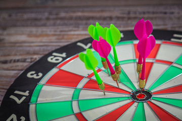 Dartboard on wood wall (miss darts)