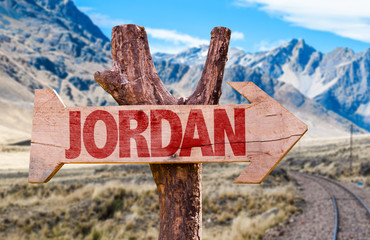 Jordan wooden sign with desert road background