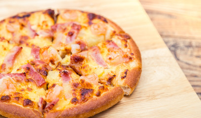 Pizza on wooden background