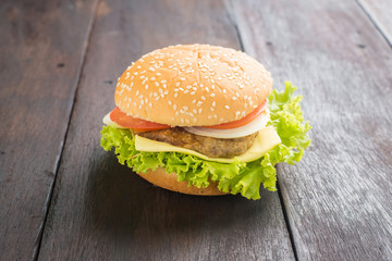 Delicious homemade hamburger on wooden desk.