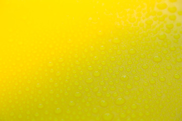 Drops of water on yellow floor