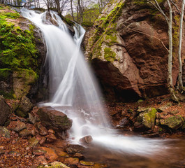 Spring time view of a waterfall among red rocks near Montana, Bulgaria
