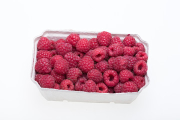 A beautiful selection of freshly picked ripe red raspberries.